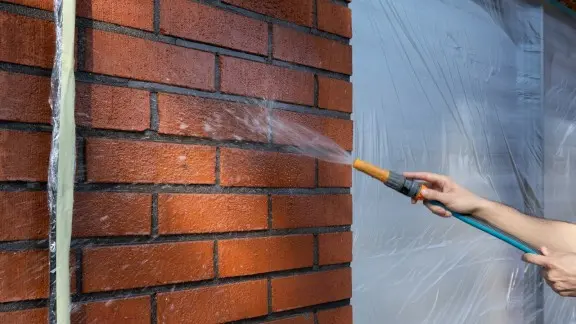 Washing a brick house 