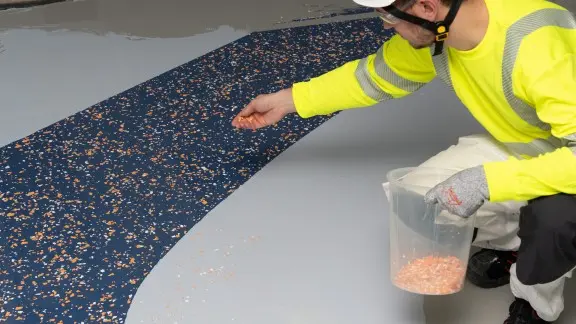 Broadcast flakes onto the freshly painted surface.