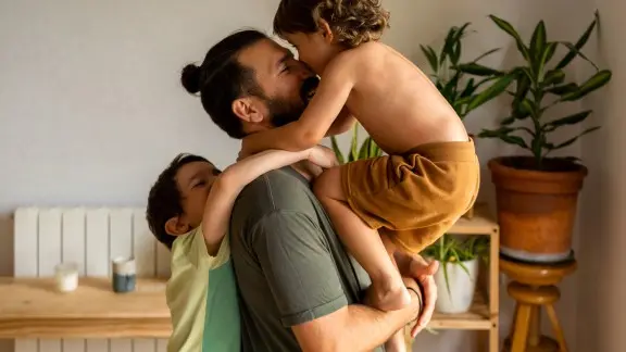 Father hugging his kids