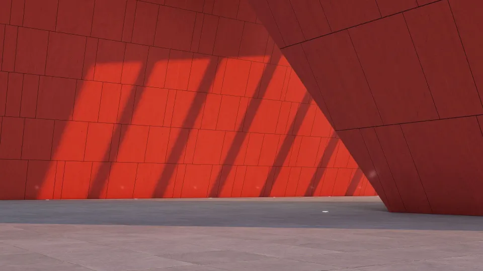 Valon ja varjon vaihtelua punaiseksi maalatulla pinnalla.