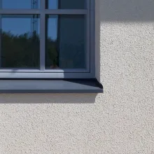 vaalea kivitalon seinä