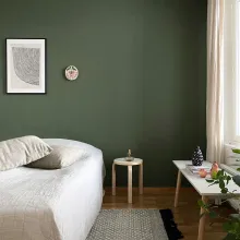 Vihreä tehosteseinä makuuhuoneessa 